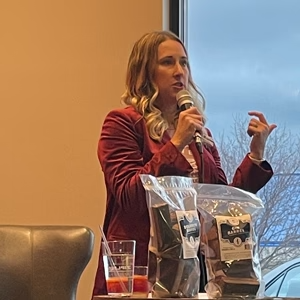 Jess shares her entrepreneurial story and business leader mindset at Capital Cigar Lounge's YPT event