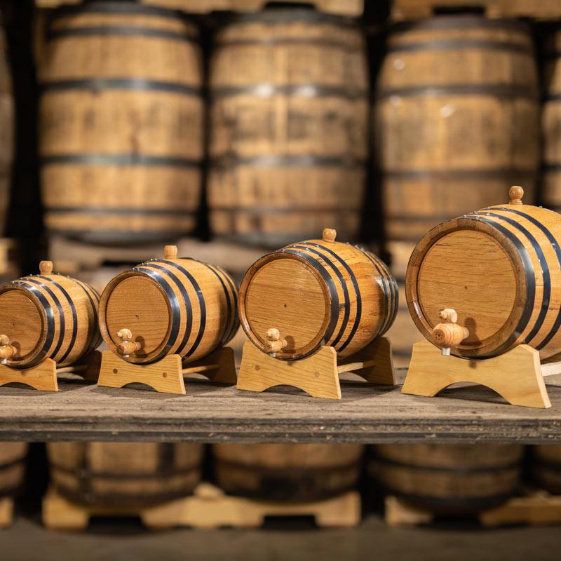 Different sizes of small, new oak aging barrels