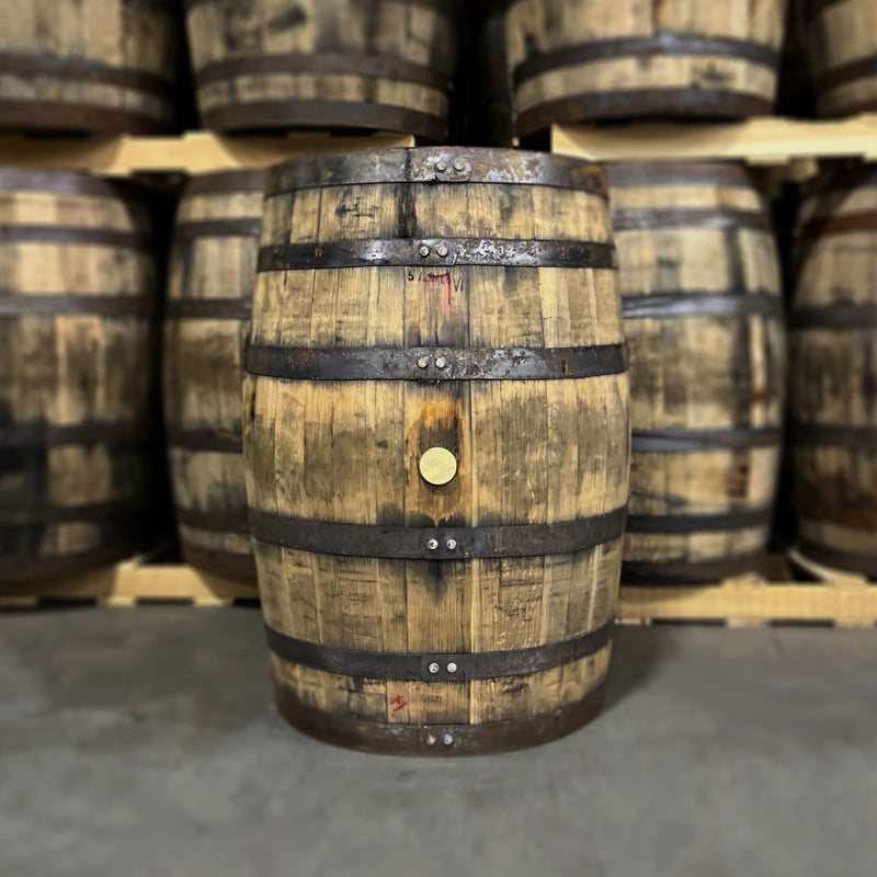 Belly bung side of an Arrington Vineyards White Wine Bourbon Barrel with other used wine ex-whiskey barrels in the background