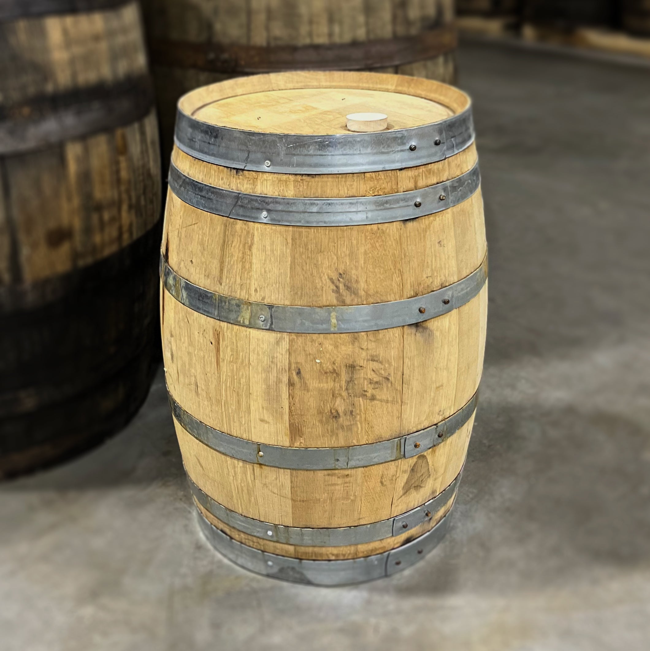 Head and side of a 15 Gallon Kennay Farms Distilling Whiskey Barrel