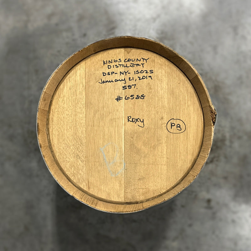 Head of a 15 Gallon Kings County Peated Bourbon Barrel with fill notes handwritten on the head