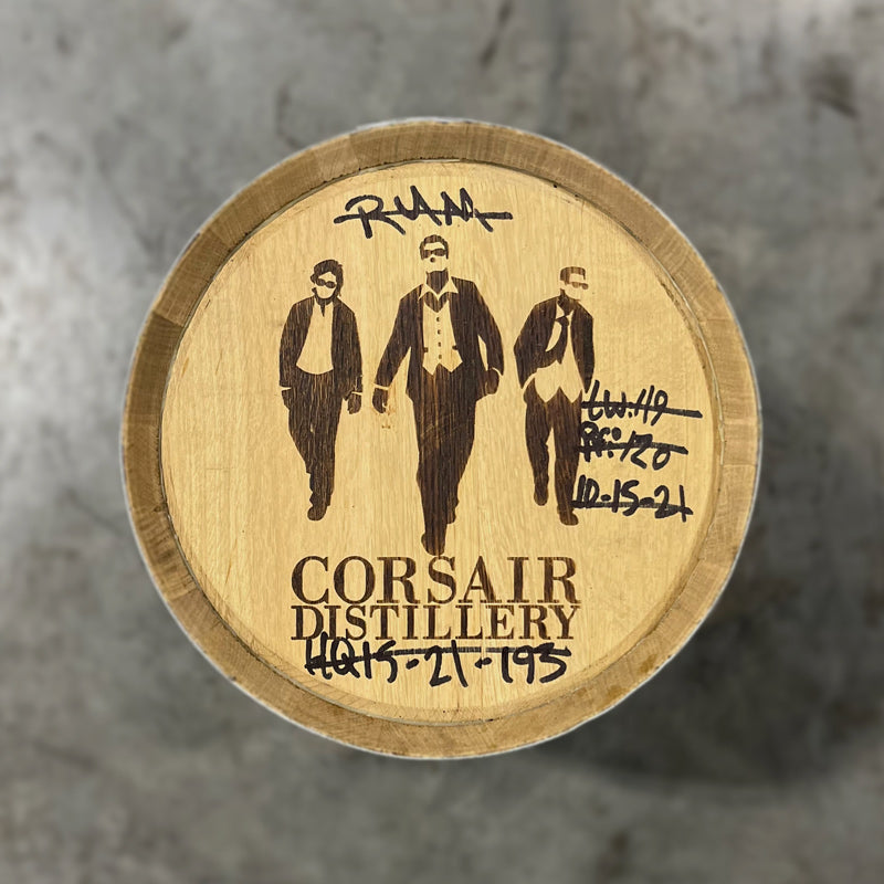 Head of a 15 Gallon Corsair Distillery Gin Barrel with handwritten notes about barrel contents around a stamped image of three men in sunglasses and suits and text Corsair Distillery