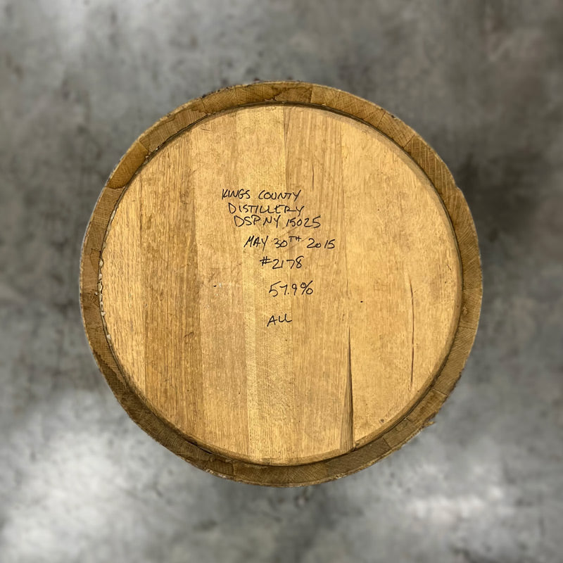 Head of a 30 Gallon Kings County Bourbon Barrel with handwritten fill and distillery notes