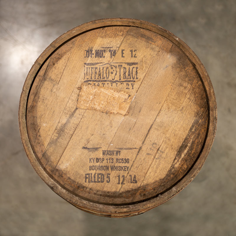 Head of a Buffalo Trace Mash 1 Bourbon Barrel with distillery information and buffalo logo stamped on the head