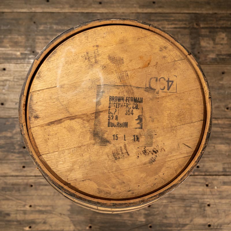View from above of head of Old Forester Bourbon barrel with distillery markings on head