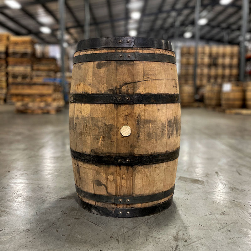 Side of a Rieger's Whiskey Barrel with dark rings and stained wood
