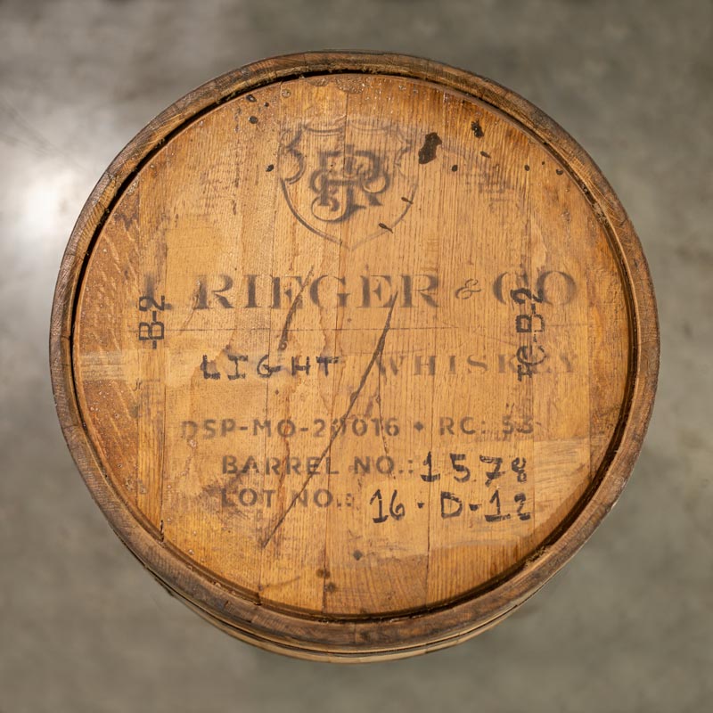 Head of a J Rieger & Co Corn Whiskey with distillery information stamped on the head