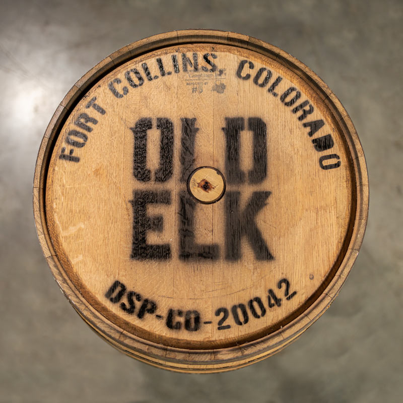 Head of an Old Elk Bourbon barrel with a head bung and Old Elk Fort Collins, Colorado DSP CO 20042 stamped on the head