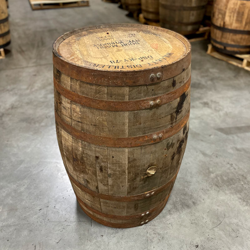 Head and side of a Willett Family Estate Rye Whiskey Barrel with distillery markings on head