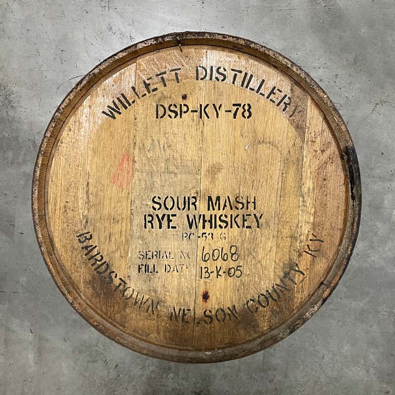 Head of a Willett Family Estate Rye Whiskey barrel with distillery markings stamped on head