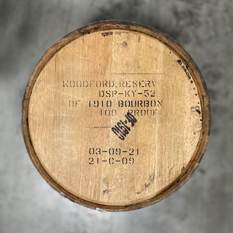 Head of an Old Forester 1910 Bourbon Whisky Barrel with Woodford Reserve distillery name, information, fill dates and OF-1910 stamped on the head