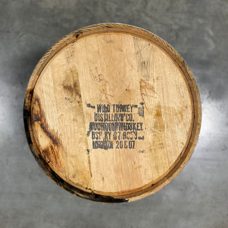 Head of a 2-Year Wild Turkey Bourbon Barrel with distillery information and fill date stamped on the head