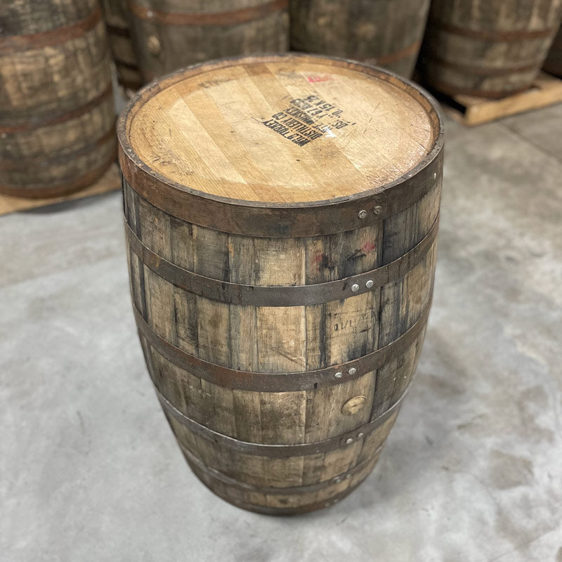 Head and side with bung of a Wild Turkey Rye Whiskey Barrel with distillery information and barrel age stamped on head