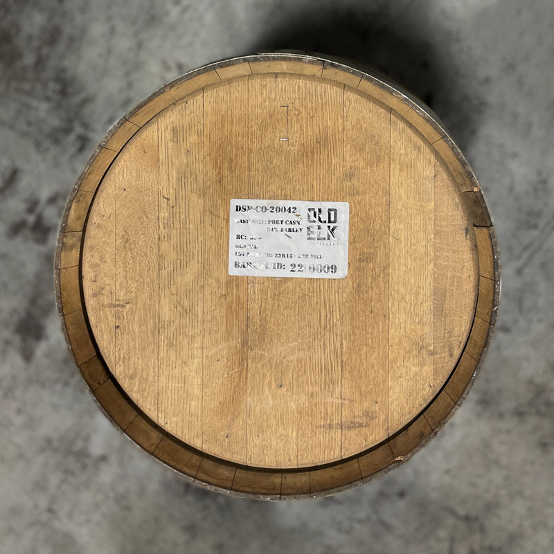 Head of an Old Elk Port Cask Finish Bourbon Barrel with a distillery sticker and information on the head
