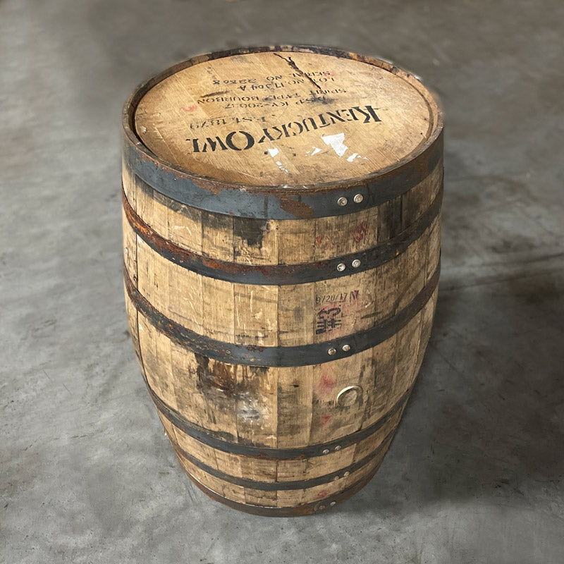Head and bunghole side of a Kentucky Owl Bourbon Barrel