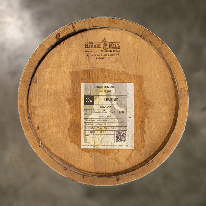 Head of a 10 Gallon Distillery 291 Rye Whiskey barrel with barrel information on a sticker attached to the head and The Barrel Mill cooperage engraving