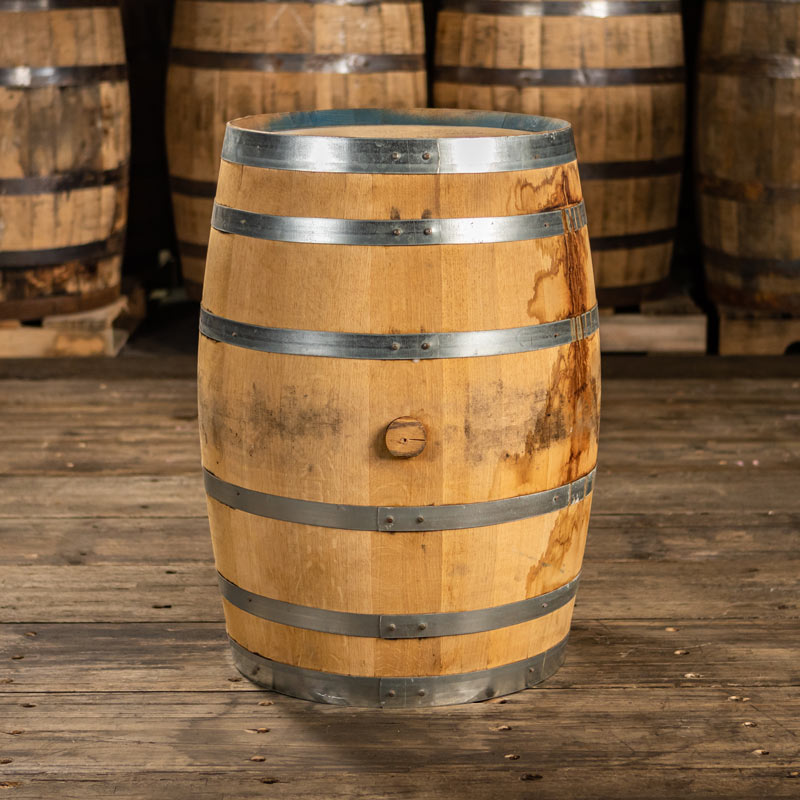 30 gallon FEW Spirits Rye Whiskey barrel with shiny steel bands and slightly stained staves