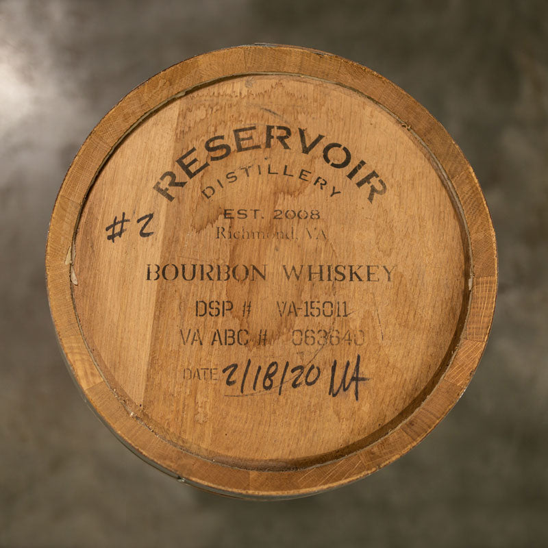 Head of a 10 Gallon Reservoir Distillery Bourbon barrel with distillery name and information stamped on the head