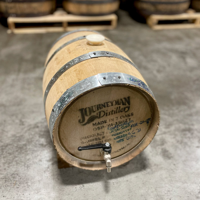 Head and side of a 5 Gallon Journeyman Rum Barrel (ex-whiskey) with a silicone bung and a spigot.