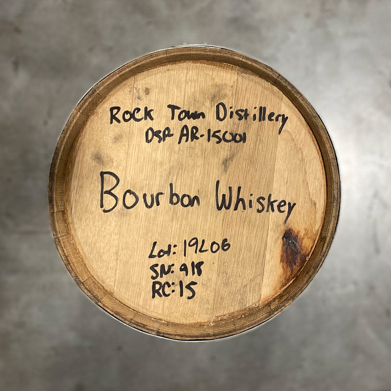 Head of a 15 Gallon Rock Town Distillery Bourbon Whiskey Barrel with handwritten information and barrel age on the head.