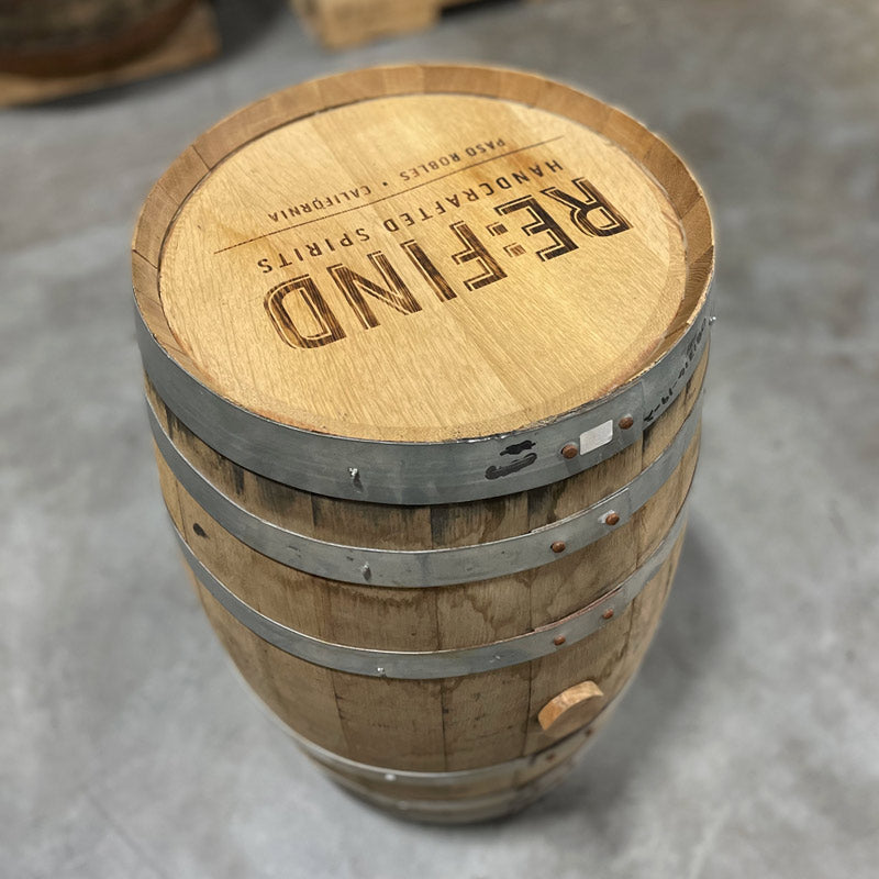 Head and side with bung of a 15 Gallon Re:Find Distillery Whiskey Barrel with Re:Find Distillery Handcrafted Spirits Paso Robles, California stamped on the head