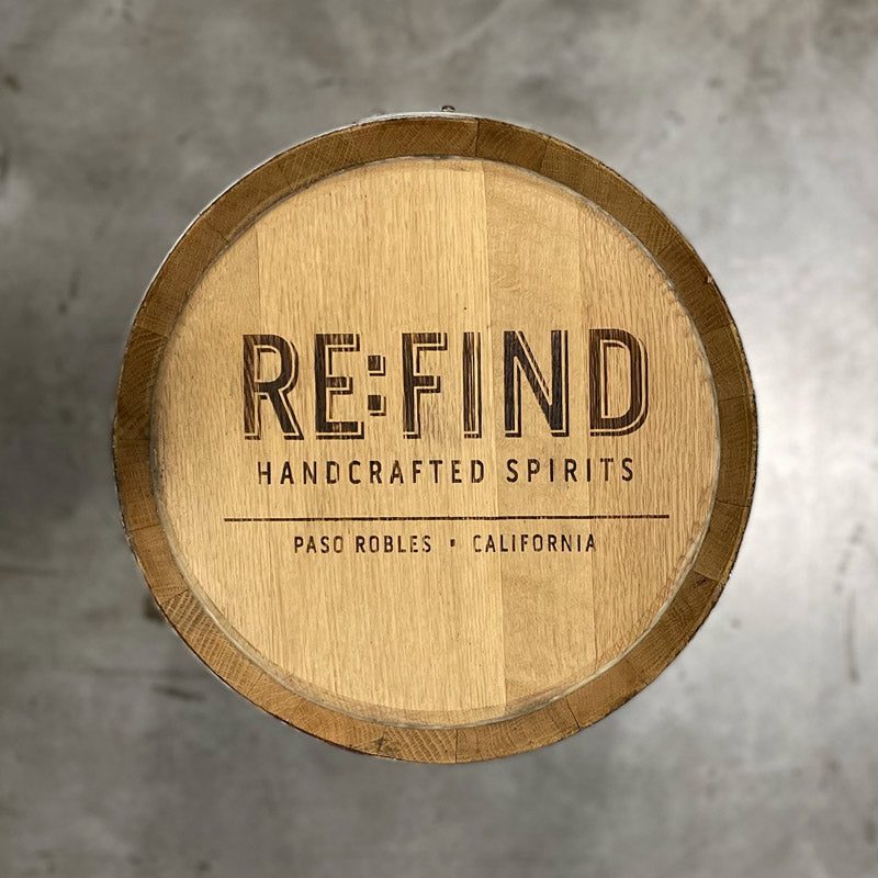 Head of a 10 Gallon Re:Find Distillery Barrel with Re:Find Handcrafted Spirits Paso Robles, California stamped on the head