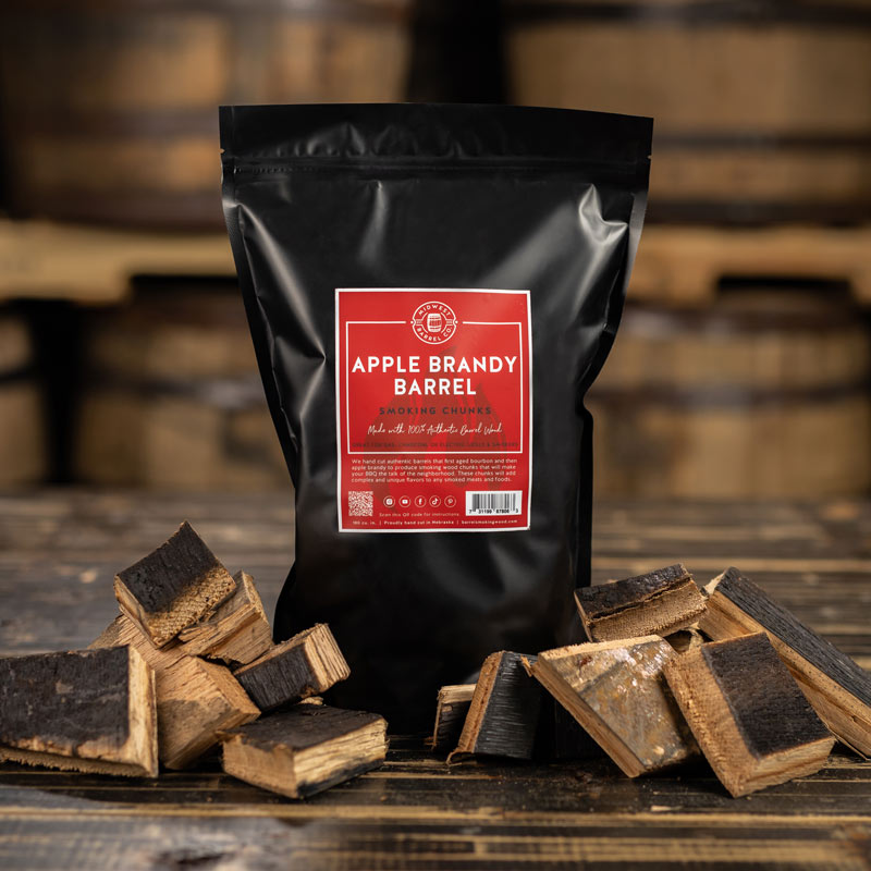 Bag of Genuine Apple Brandy Barrel Smoking Wood Chunks with charred chunks arranged around the bag