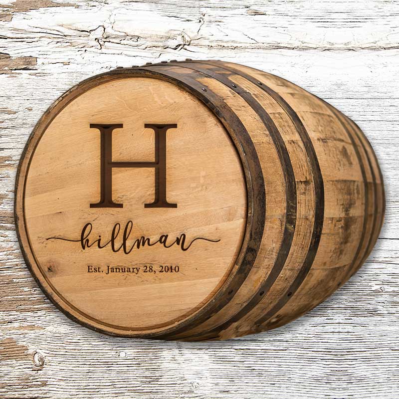 Engraved full size whiskey barrel with H initial, Hillman family name and Est. January 28, 2040