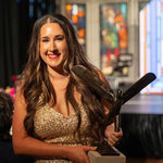 Jess Loseke, Co-Founder & CEO of Midwest Barrel Co., holds a trophy presented to her for being named Pipeline Entrepreneurs Innovator of the Year