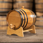 Small liter oak aging barrel on a stand