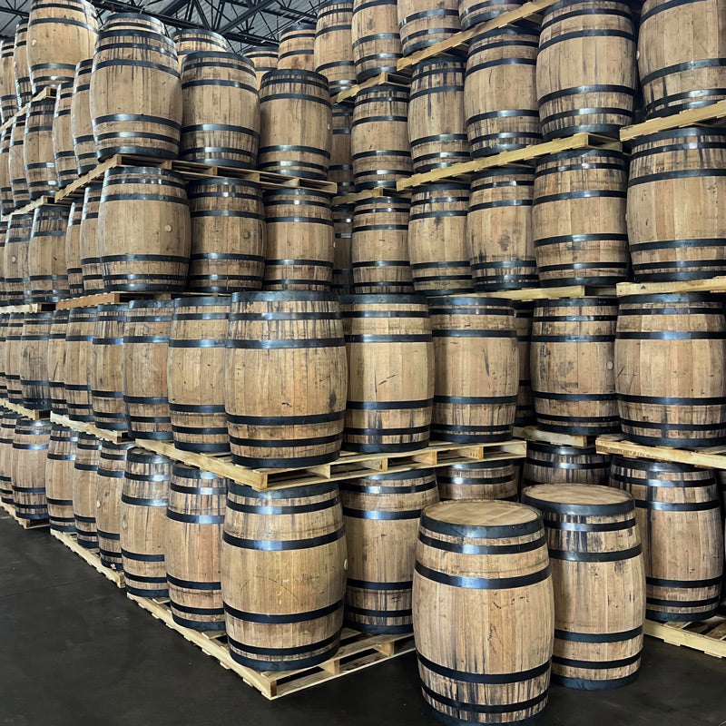 Stacks of pallets of brand new, never-used, full-size, 53 gallon whiskey barrels