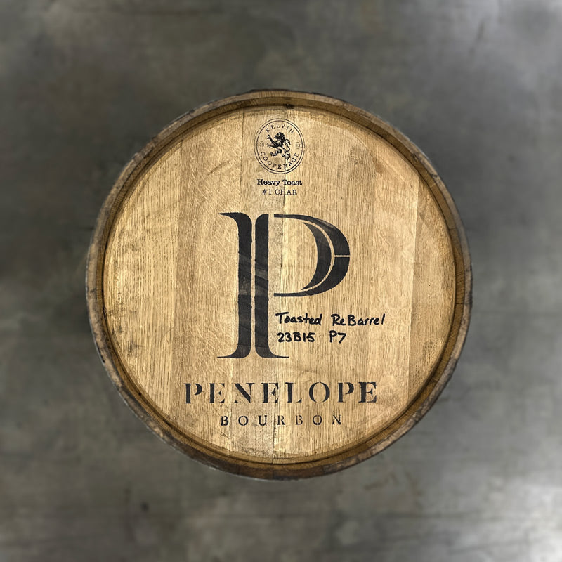 Head of a Penelope Toasted Bourbon Barrel with large P and Penelope Bourbon stamped on the barrel, plus Toasted Barrel and fill information handwritten on the head