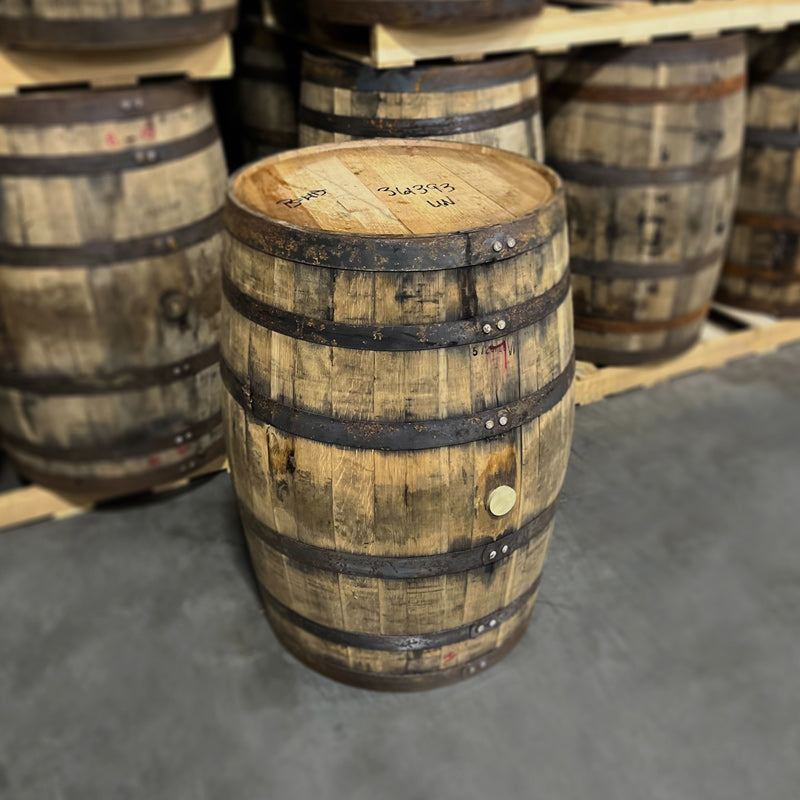 Head and side of an Arrington Vineyards White Wine Whiskey Barrel with other ex-whiskey wine barrels in the background