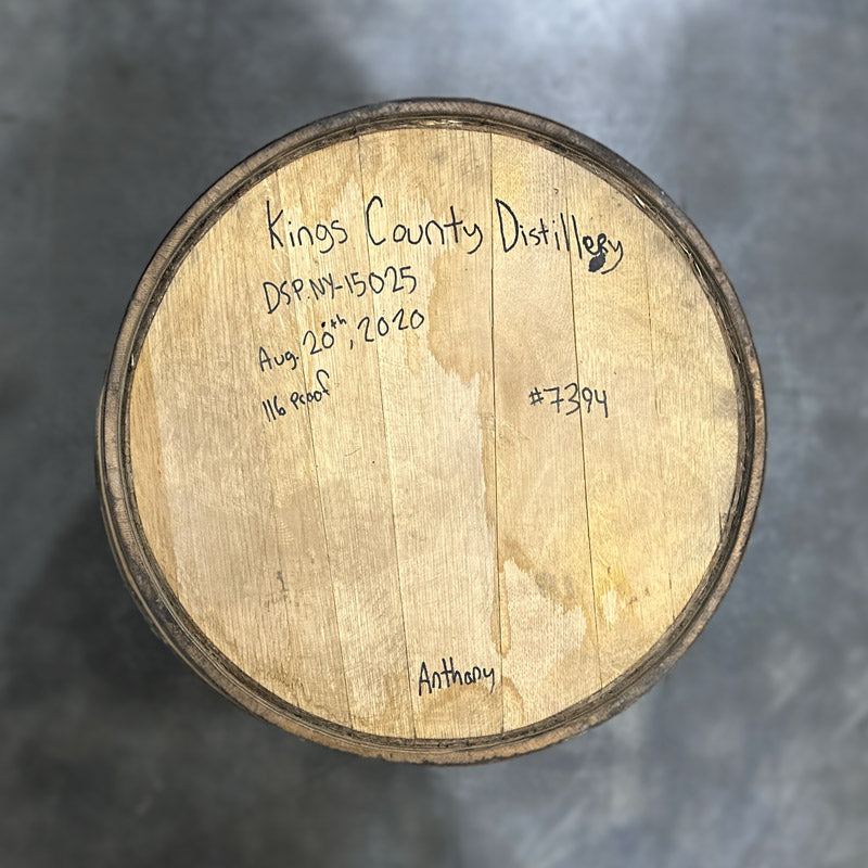Head of a Kings County Distillery Bourbon Barrel with distillery information and fill date handwritten on the head