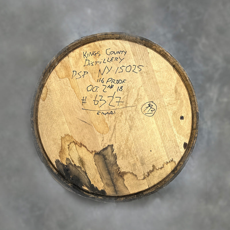 Head of a Kings County Peated Bourbon Barrel with distillery information handwritten on the head
