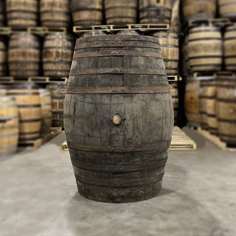 
                  
                    Side and head of a Templeton Rye Olroso Sherry Cask Finished Whiskey Barrel with other used whiskey barrels in the background
                  
                