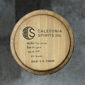 
                  
                    Head of a Caledonia Barrel Hill Tom Cat Gin Barrel with Caledonia Spirits logo, name and spirit information stamped on the head
                  
                