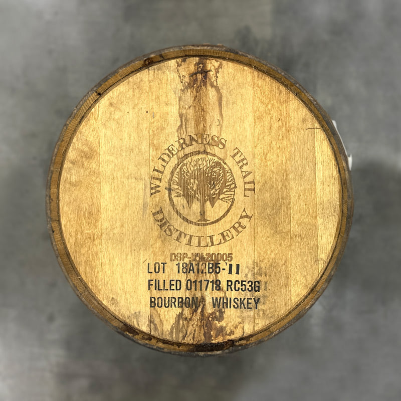 Head of a Wilderness Trail Distillery Monk's Road Gin Barrel with tree logo engraving and fill date stamp