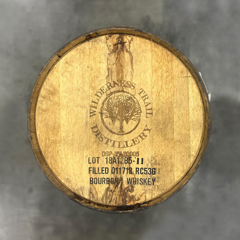 
                  
                    Head of a Wilderness Trail Distillery Monk's Road Gin Barrel with tree logo engraving and fill date stamp
                  
                