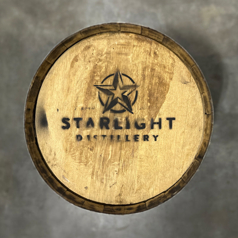 Head of a 70 Gallon Starlight Bourbon Barrel Ex-Armagnac with a star inside a circle logo and words Starlight Distillery stamped on the head