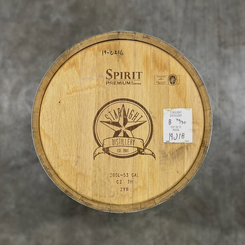 Head of a Starlight Blackberr Wine Barrel with star and circle logo engraved on the head