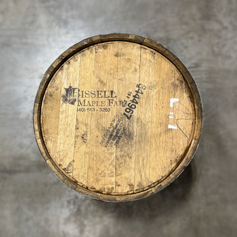 
                  
                    Head of a Bissell Maple Syrup Barrel with Bissell Maple Farm maple leaf logo and Heaven Hill Distillery bourbon stamp information
                  
                