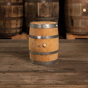 
                  
                    Side with belly bung of a 5 Gallon Fresh Bourbon Distillery Bourbon Barrel and used bourbon barrels in the background
                  
                