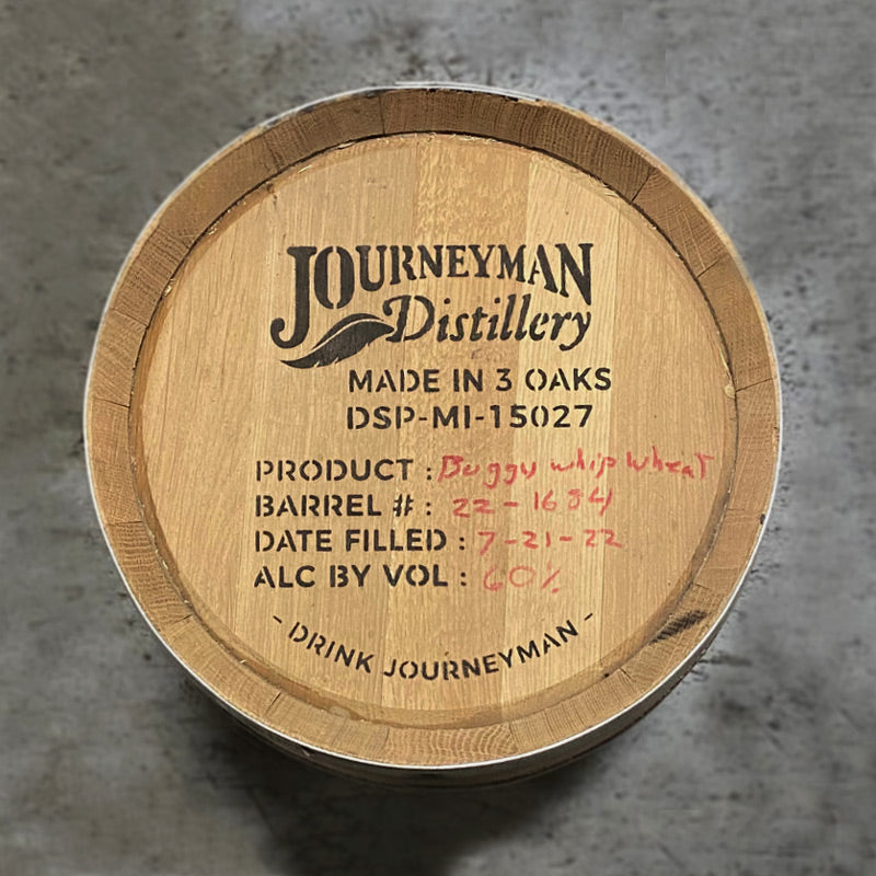 Head of a 5 Gallon Journeyman Wheat Whiskey Barrel with Journeyman Distillery and whiskey info stamped on the barrel