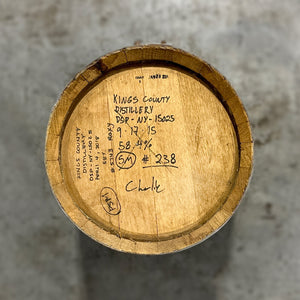 
                  
                    Head of a 5 Gallon Kings County Single Malt Whiskey Barrel with handwritten fill notes on the head
                  
                