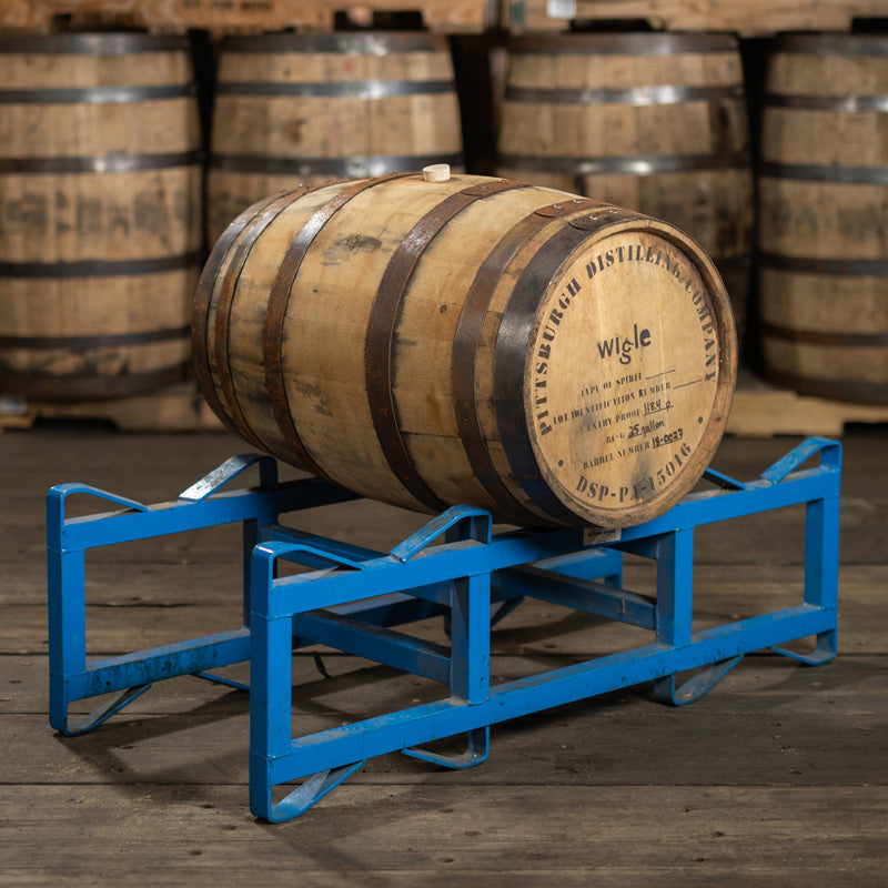 25 Gallon Wigle Vermouth Barrel on a steel barrel rack