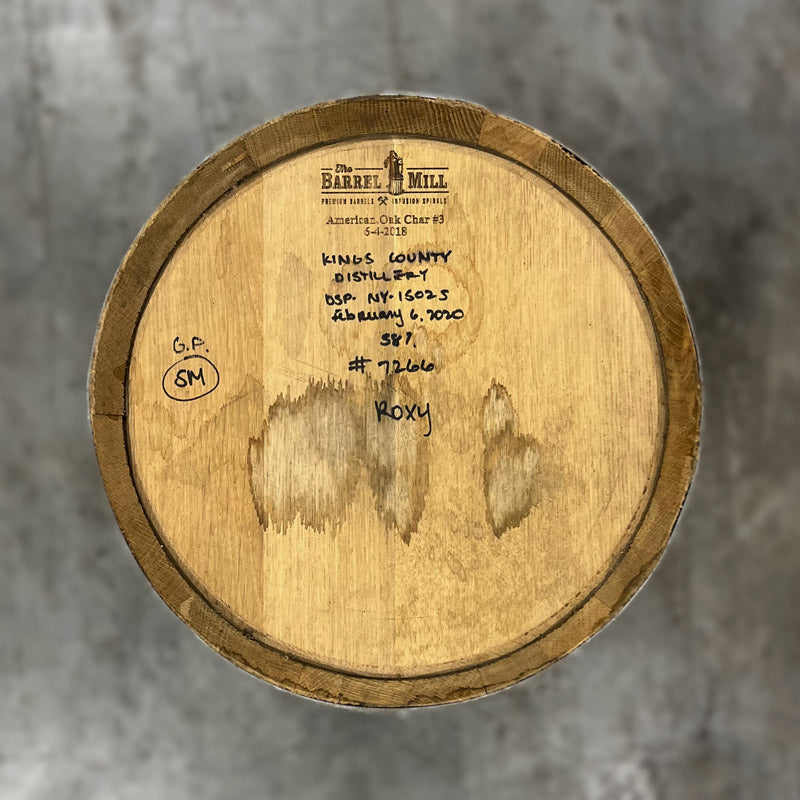 Head of a 10 Gallon Kings County Single Malt Whiskey Barrel with handwritten distillery and fill info on the head