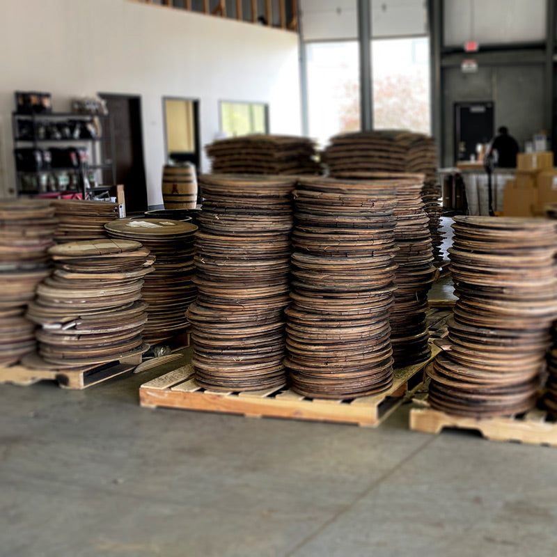 
                  
                    Whiskey and bourbon barrel heads on pallets
                  
                