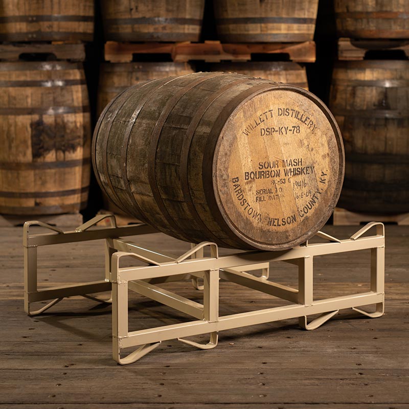 
                  
                    Decor grade Willett Bourbon Barrel on a rack in front of other barrels
                  
                