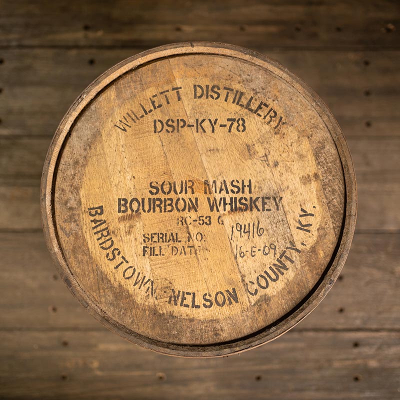 
                  
                    Willett Bourbon barrel head with distillery information stamped on the head
                  
                